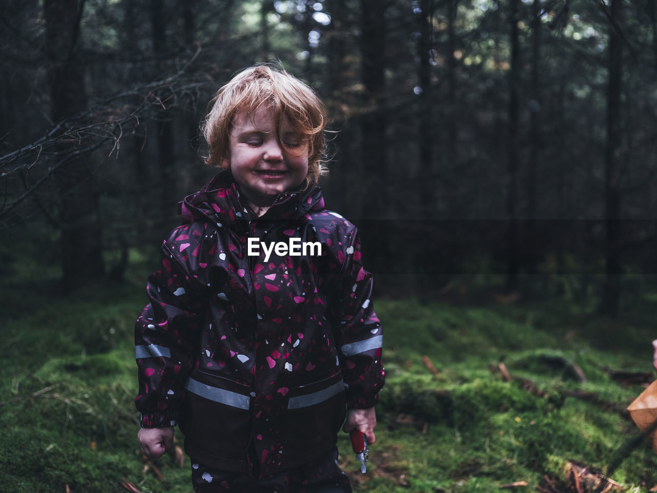 Toddler girl in forest