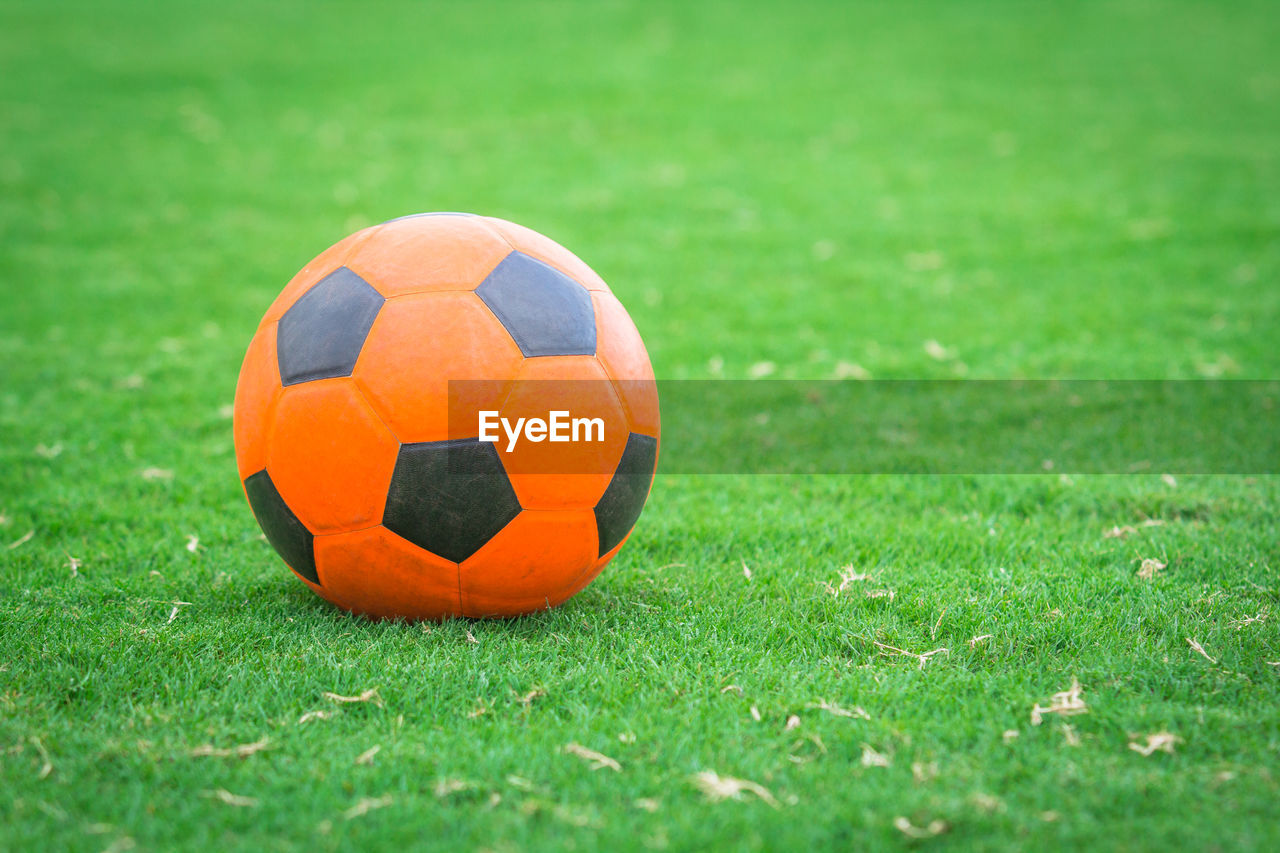 Close-up of soccer ball on field