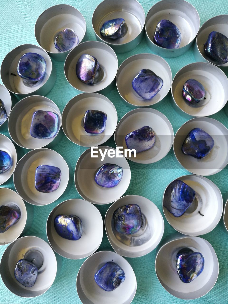 Directly above shot of gemstones in bowls on table