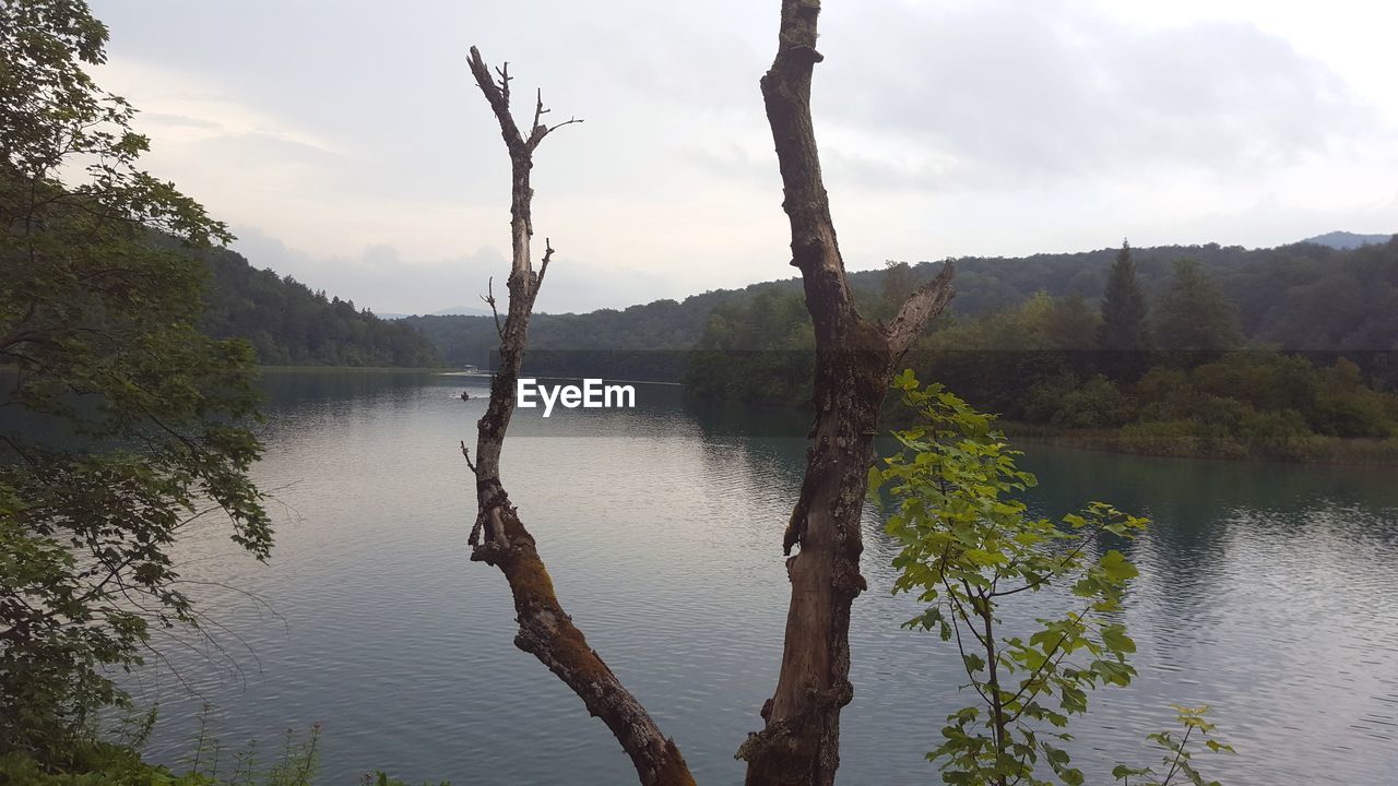 SCENIC VIEW OF LAKE AND MOUNTAINS