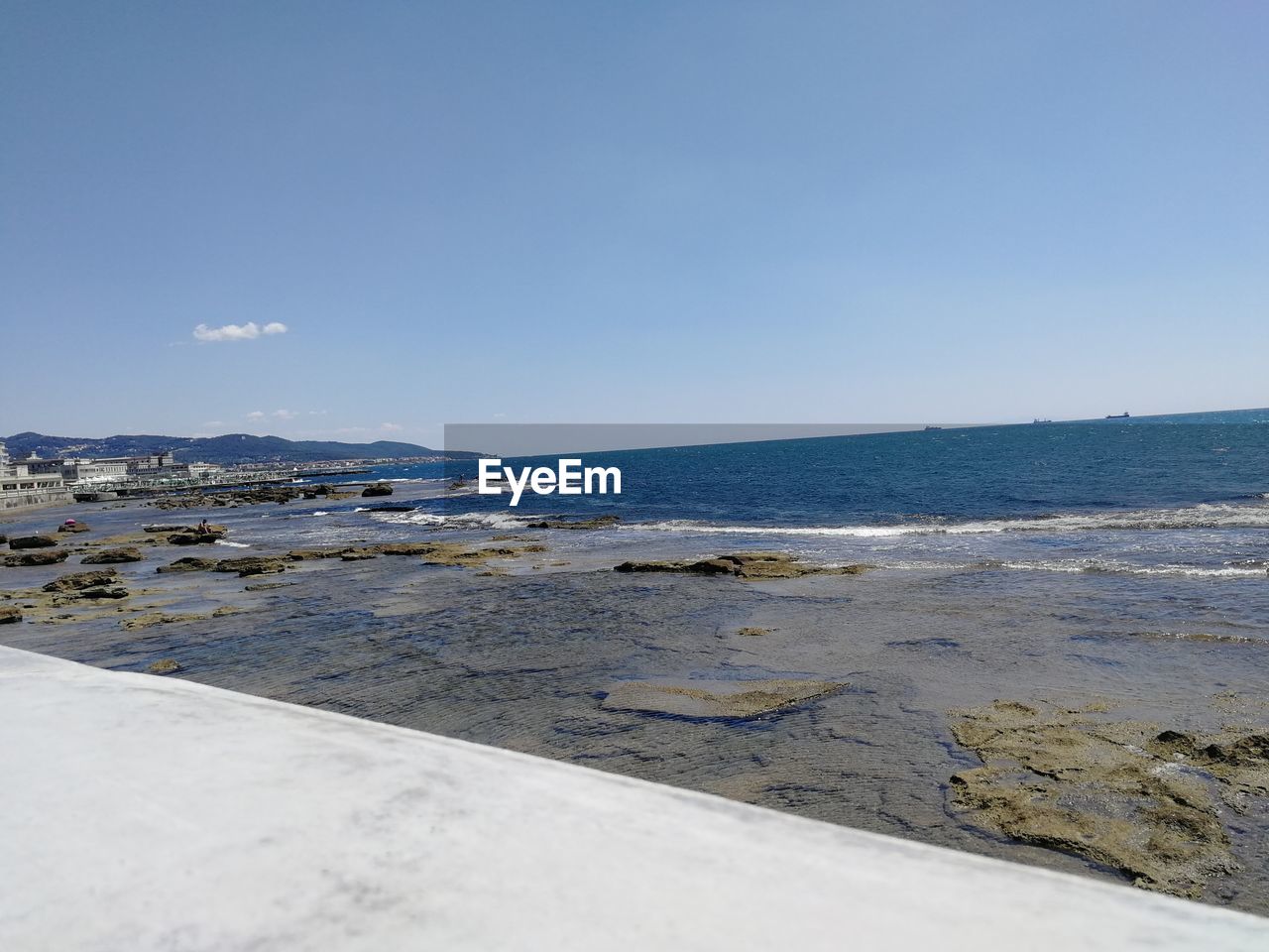 SCENIC VIEW OF BEACH AGAINST CLEAR SKY