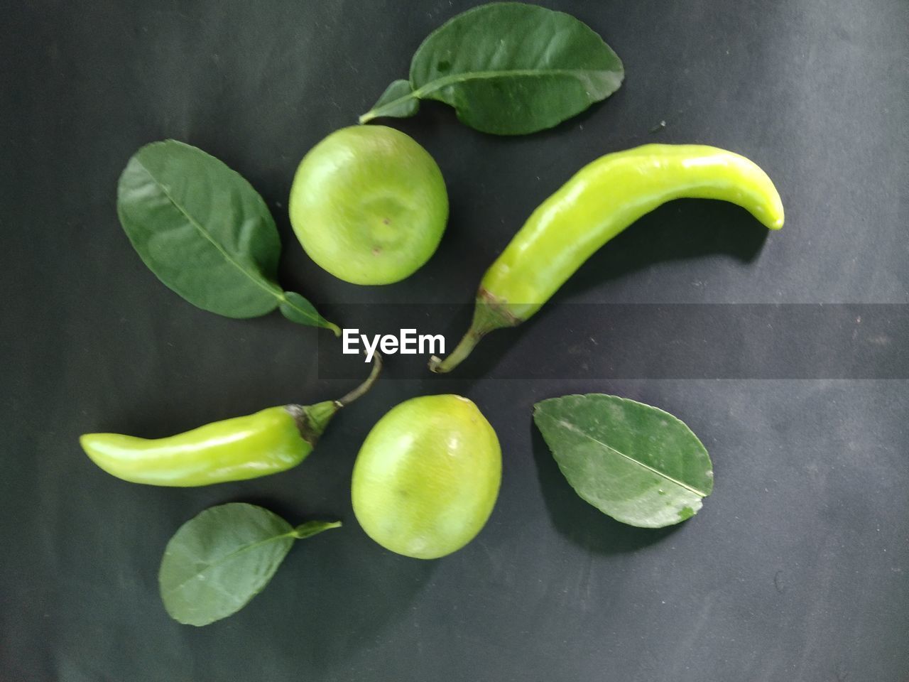 HIGH ANGLE VIEW OF FRUITS AND LEAVES