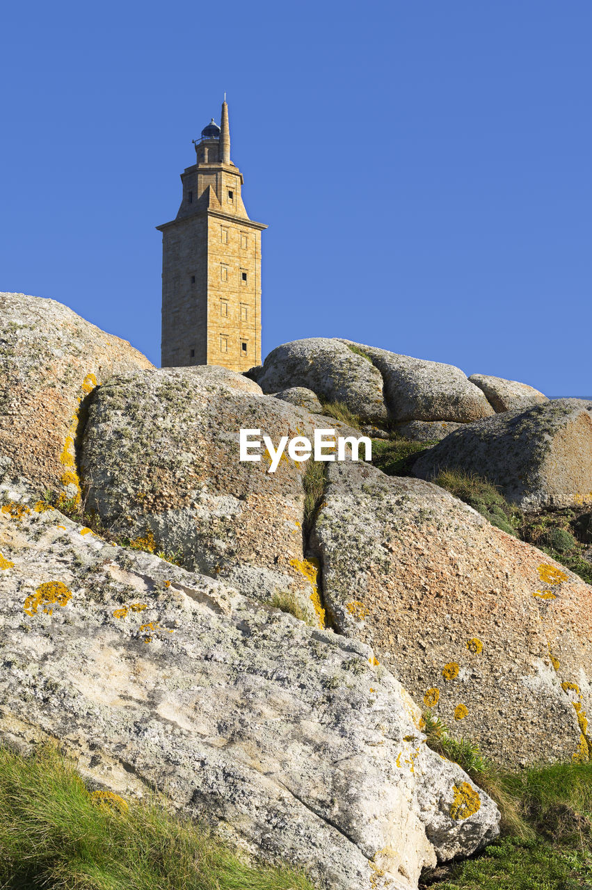 Tower of hercules against clear blue sky