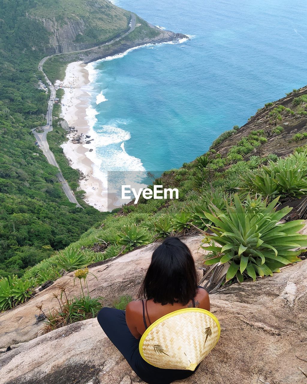 Rear view of woman looking at sea 