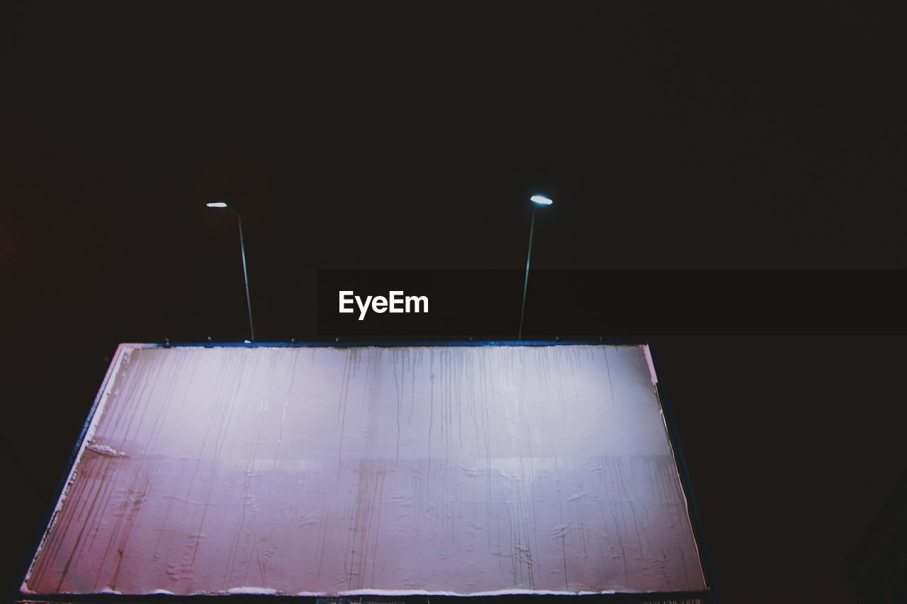 Blank billboard with light at night