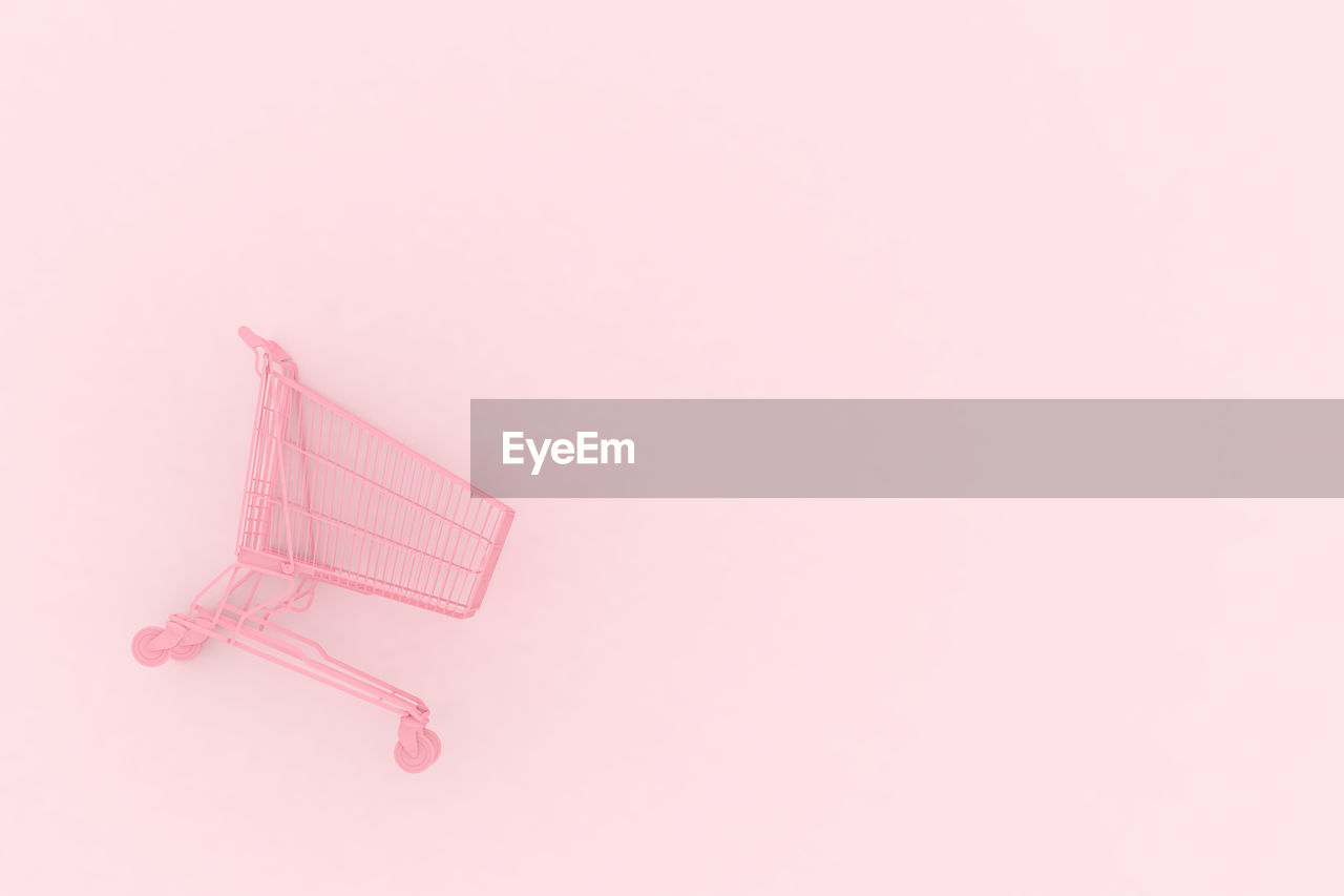 pink, copy space, studio shot, no people, shopping cart, indoors, single object, magenta, consumerism, shopping, cut out, retail