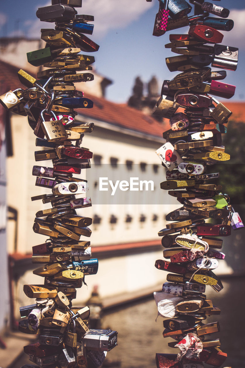 Close-up of padlocks hanging on a bridge