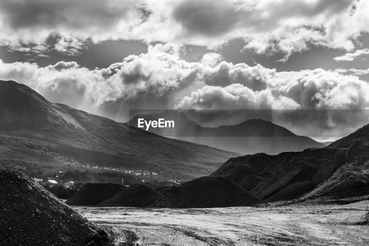 mountain, environment, landscape, cloud, scenics - nature, sky, beauty in nature, black and white, mountain range, nature, land, monochrome, monochrome photography, travel, no people, snow, travel destinations, tranquility, dramatic sky, outdoors, non-urban scene, cloudscape, fog, tranquil scene, dramatic landscape, valley, day, tourism, cold temperature, water, idyllic, overcast, sunlight