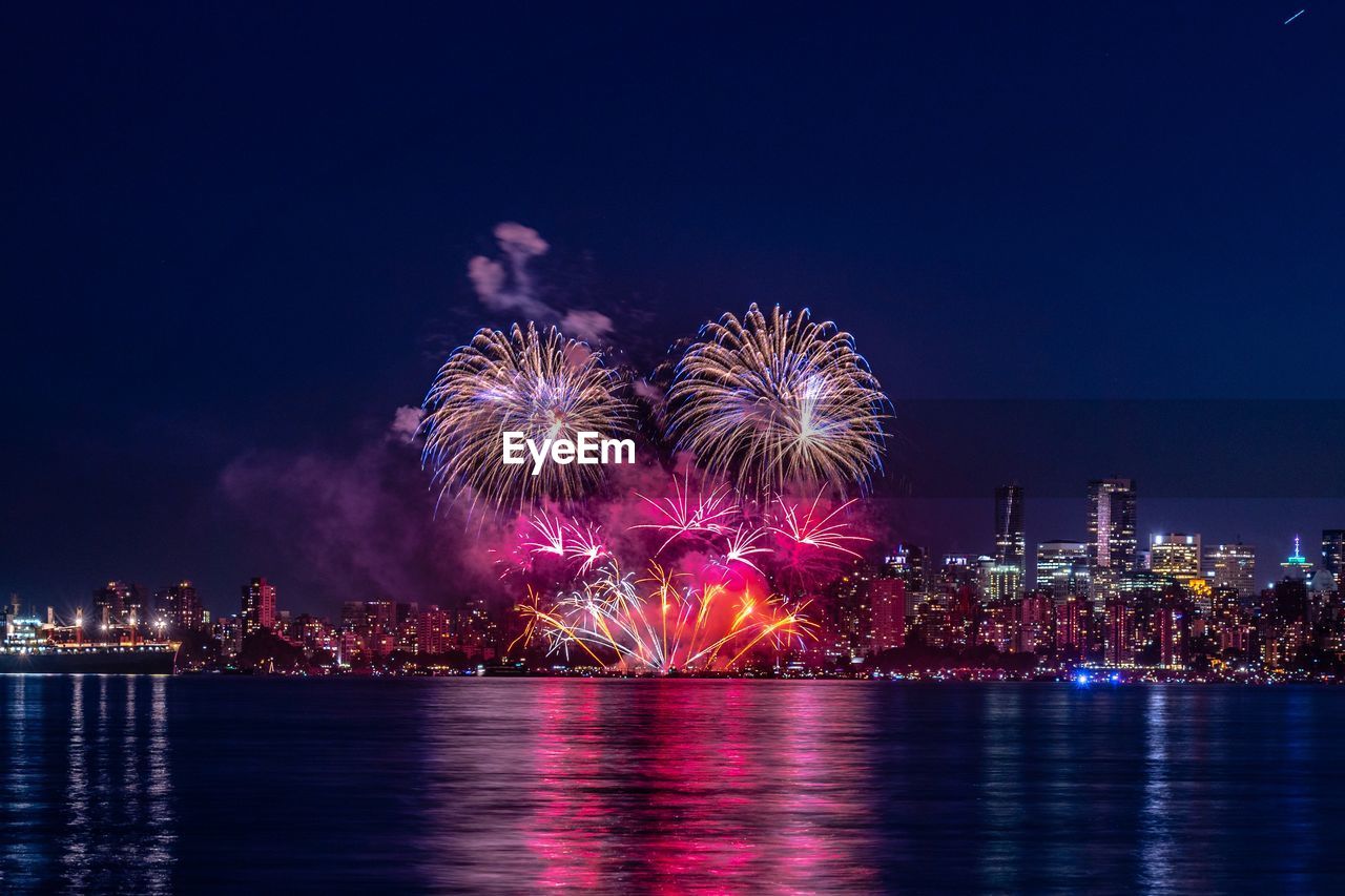 Firework display over vancouver at night 