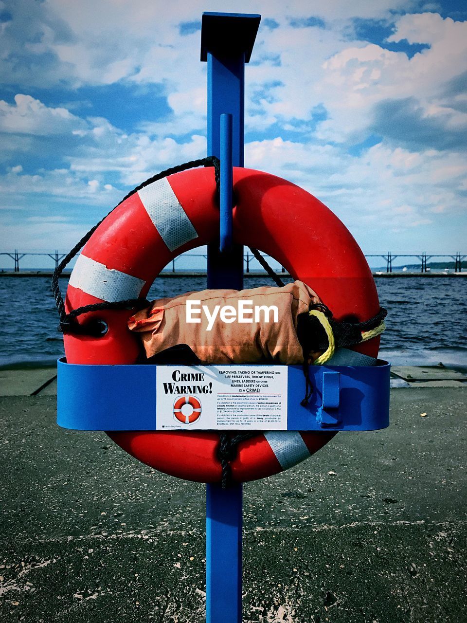 INFORMATION SIGN ON SHORE AGAINST SKY