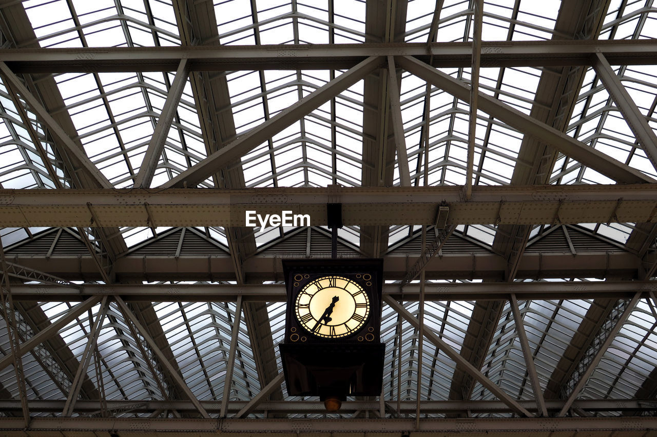 Low angle view of illuminated ceiling at railroad station