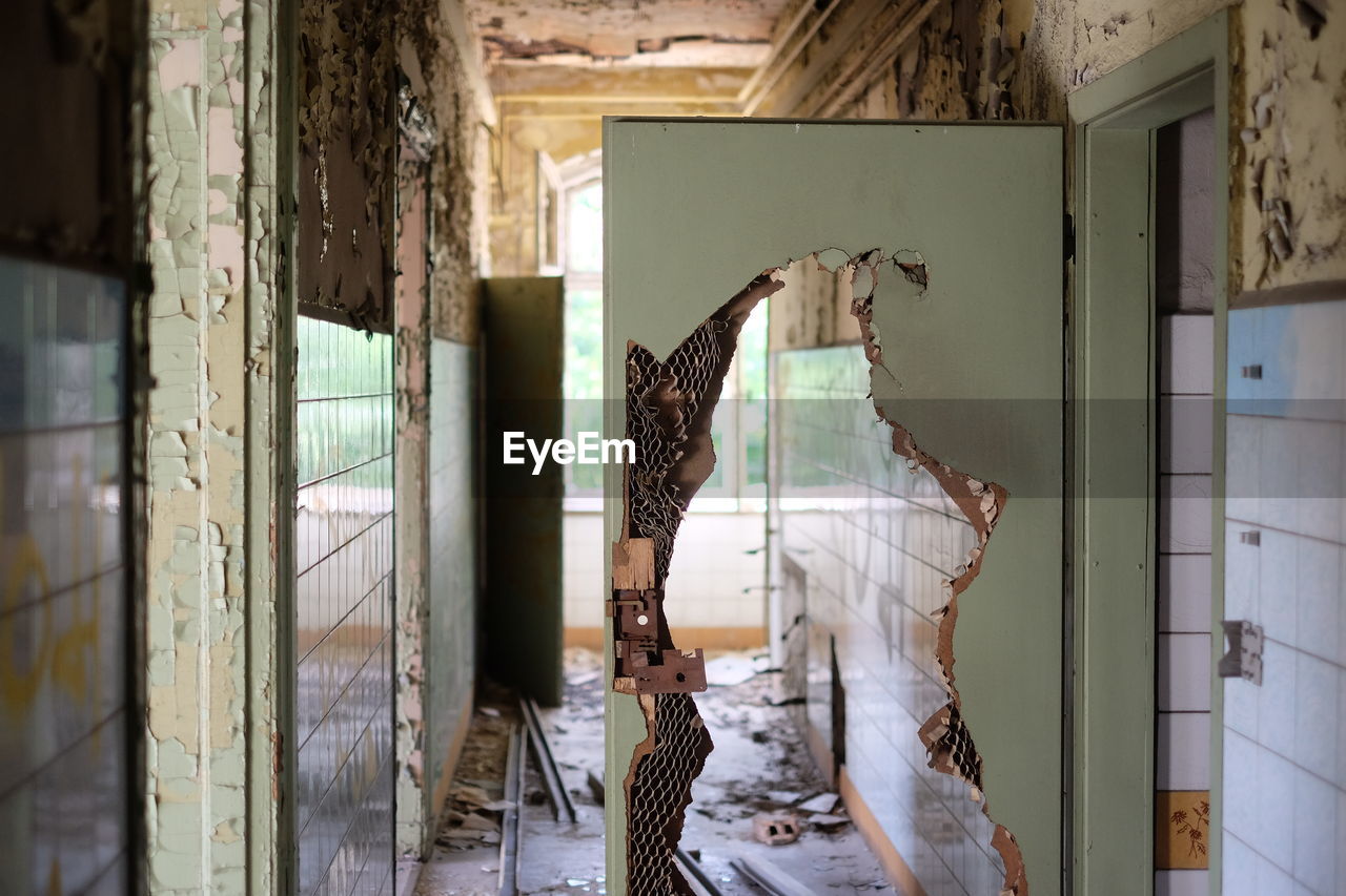 Broken door in abandoned house