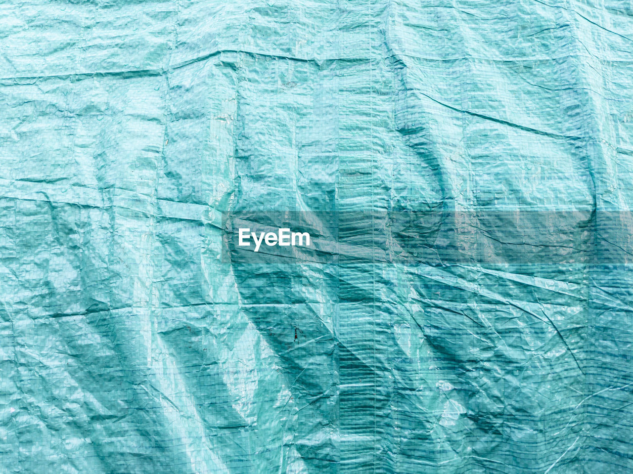 Full frame shot of blue textured tarpaulin