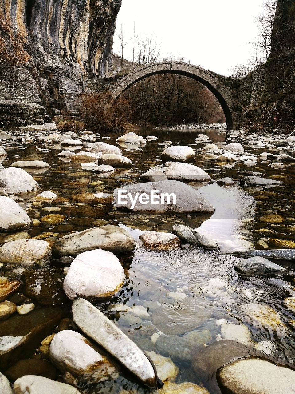 WATER FLOWING FROM STONE WALL