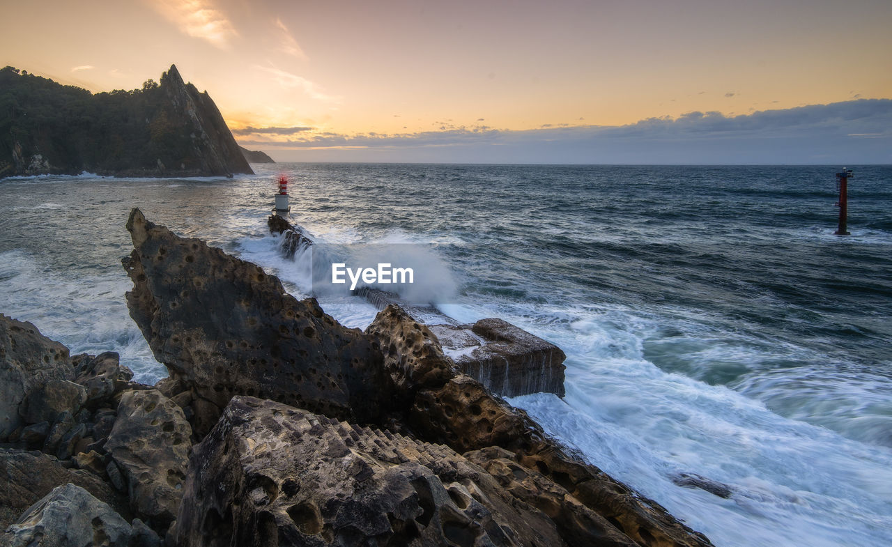 scenic view of sea against sky at sunset