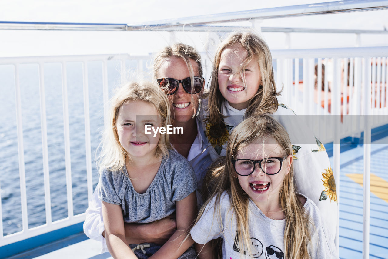 Mother with daughters on ferry