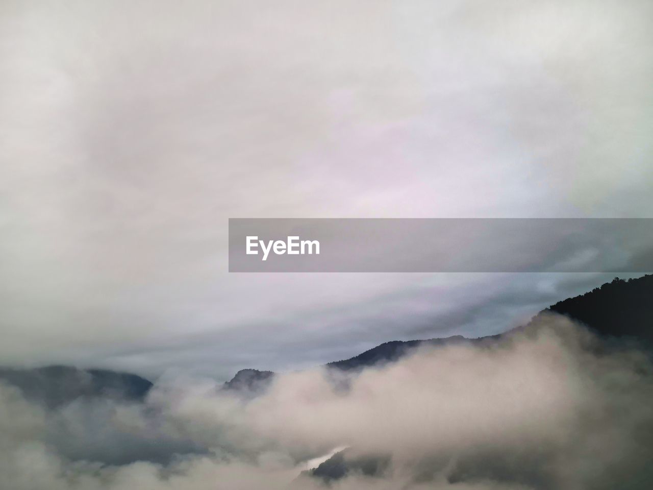 cloud, environment, fog, mountain, sky, beauty in nature, mist, nature, scenics - nature, landscape, no people, outdoors, mountain range, morning, travel, tranquility, smoke, non-urban scene, cloudscape, day, land, dramatic sky, atmospheric mood, copy space, tranquil scene