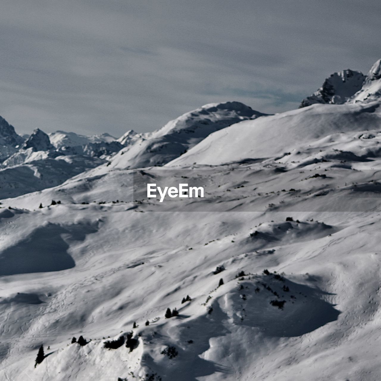 Scenic view of snow covered landscape against sky