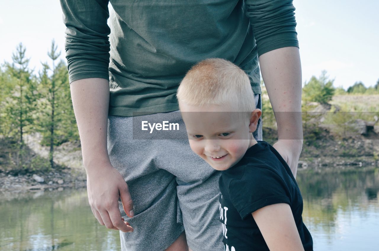 Portrait of father and son on shore