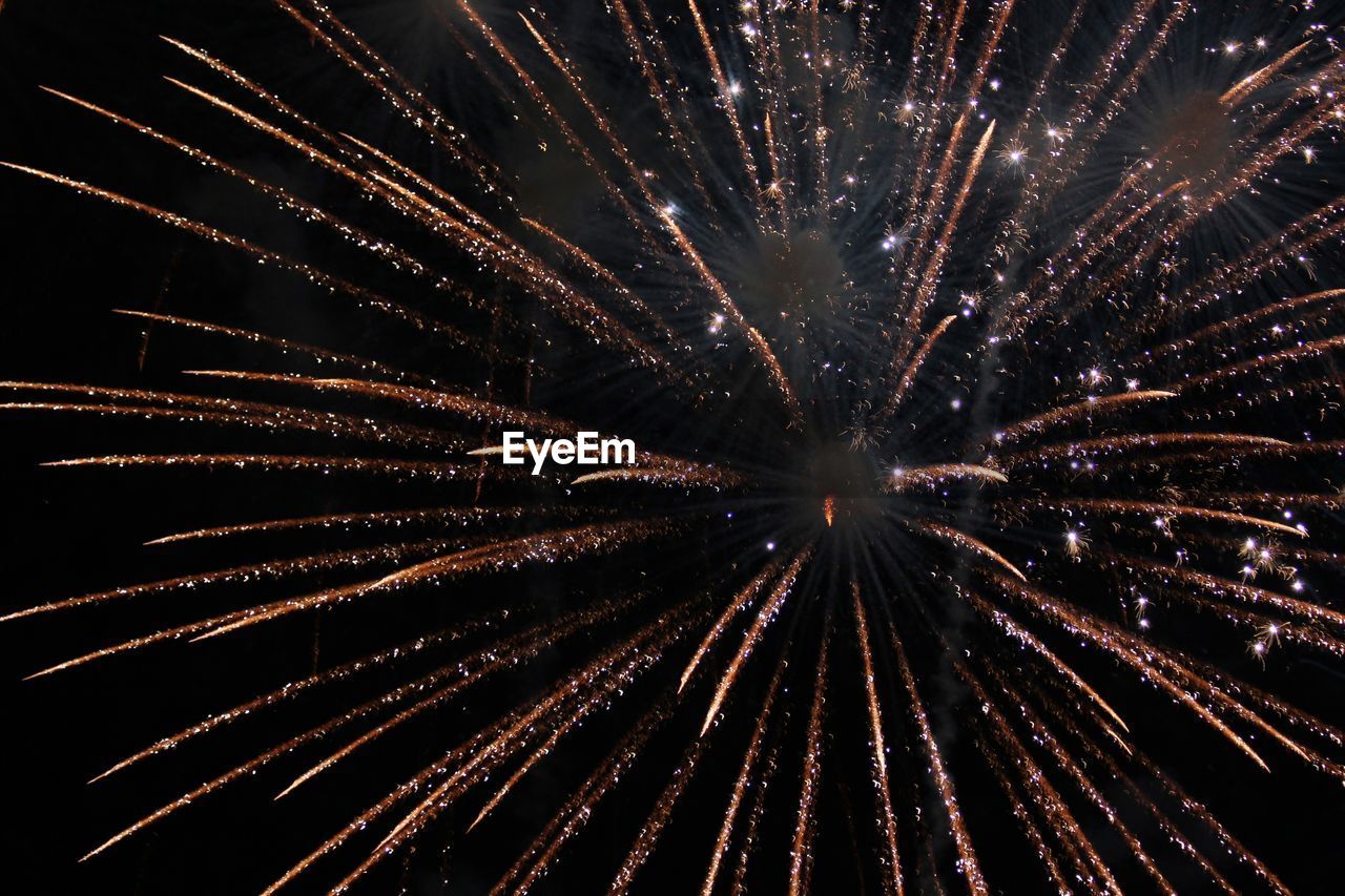 Low angle view of fireworks in night sky