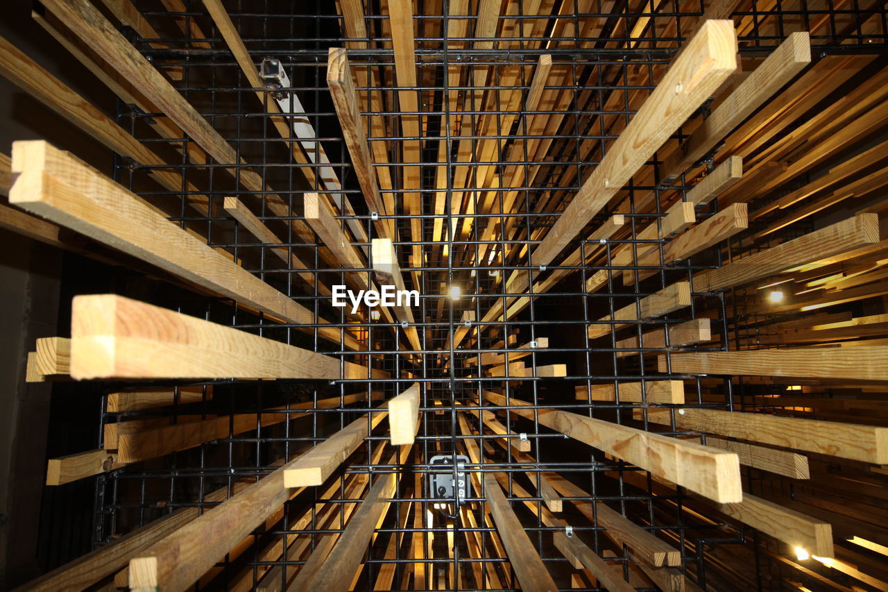 LOW ANGLE VIEW OF ILLUMINATED LIGHTS IN CEILING