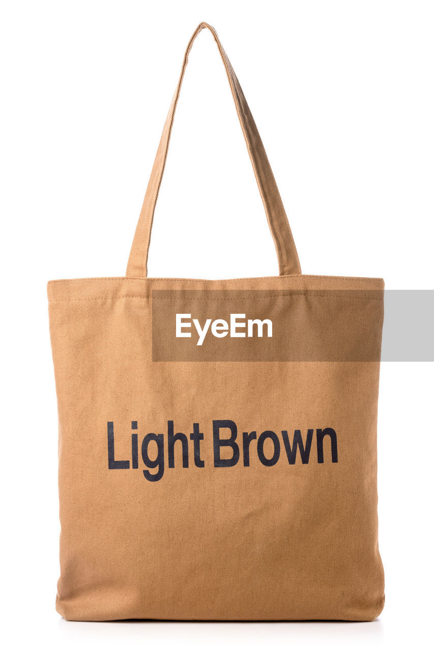 bag, handbag, tote bag, cut out, brown, white background, fashion accessory, text, paper bag, beige, label, studio shot, communication, retail, shopping bag, paper, no people, single object, shoulder bag, indoors