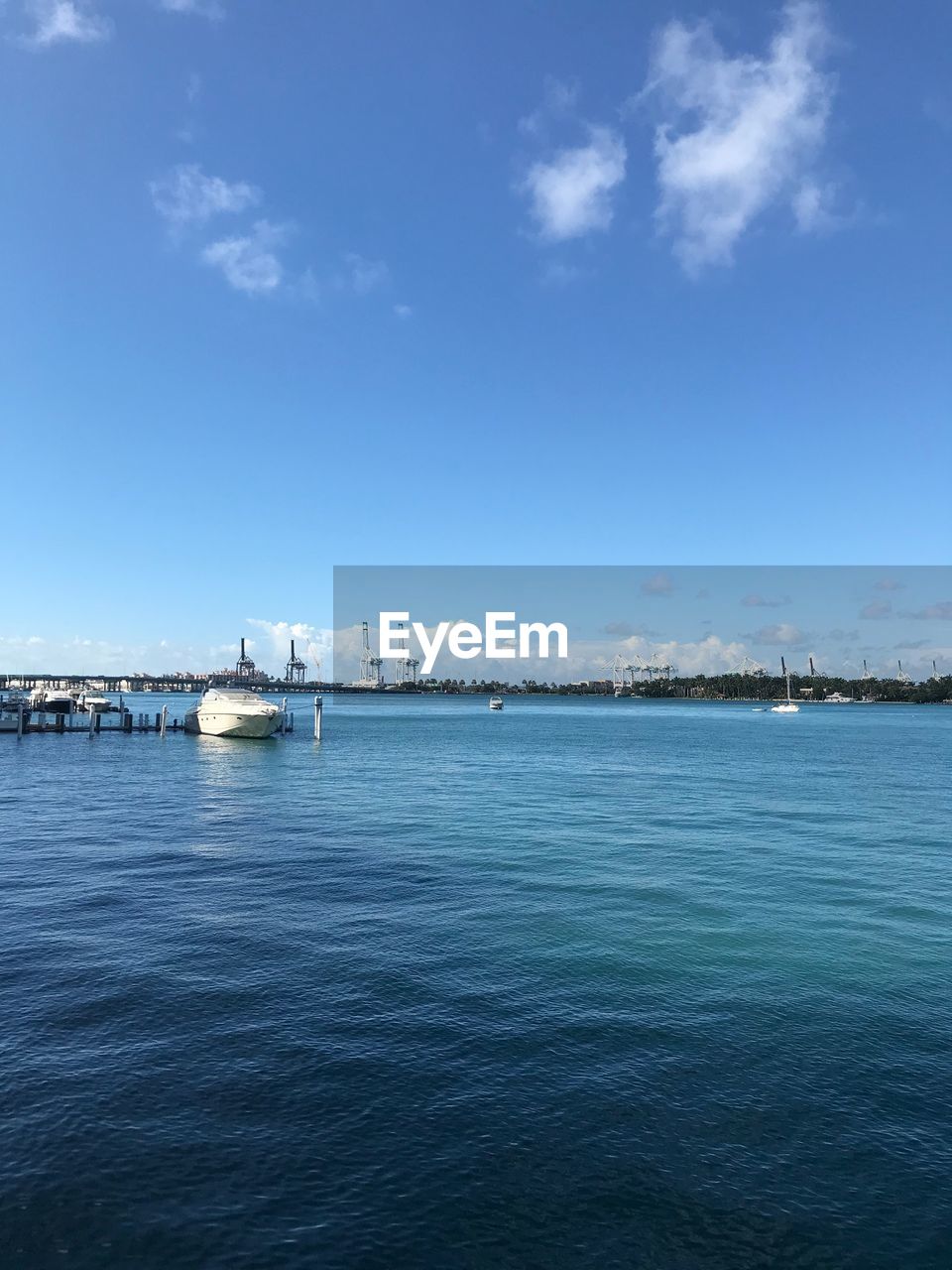 Scenic view of sea against blue sky