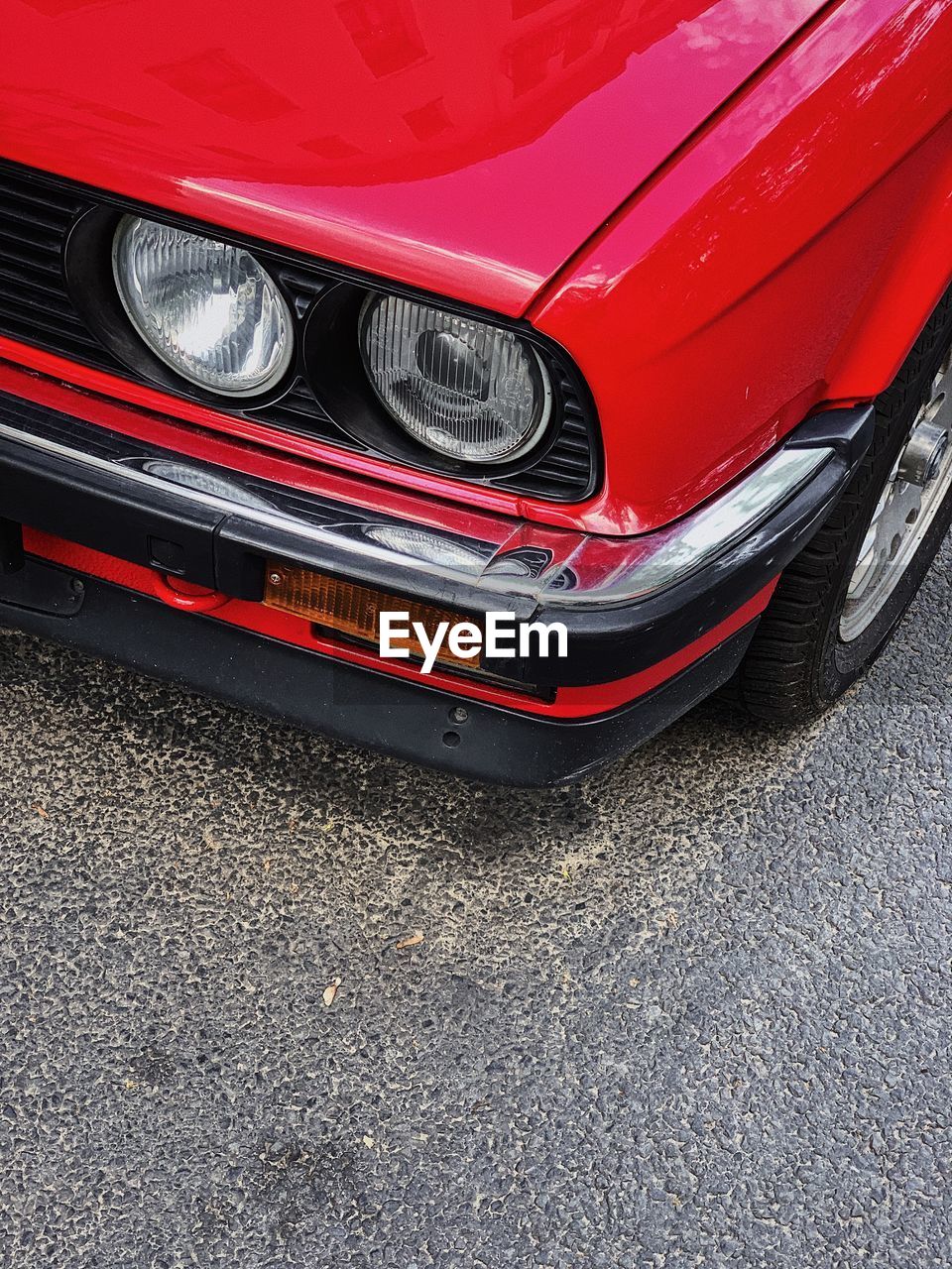 RED VINTAGE CAR ON ROAD