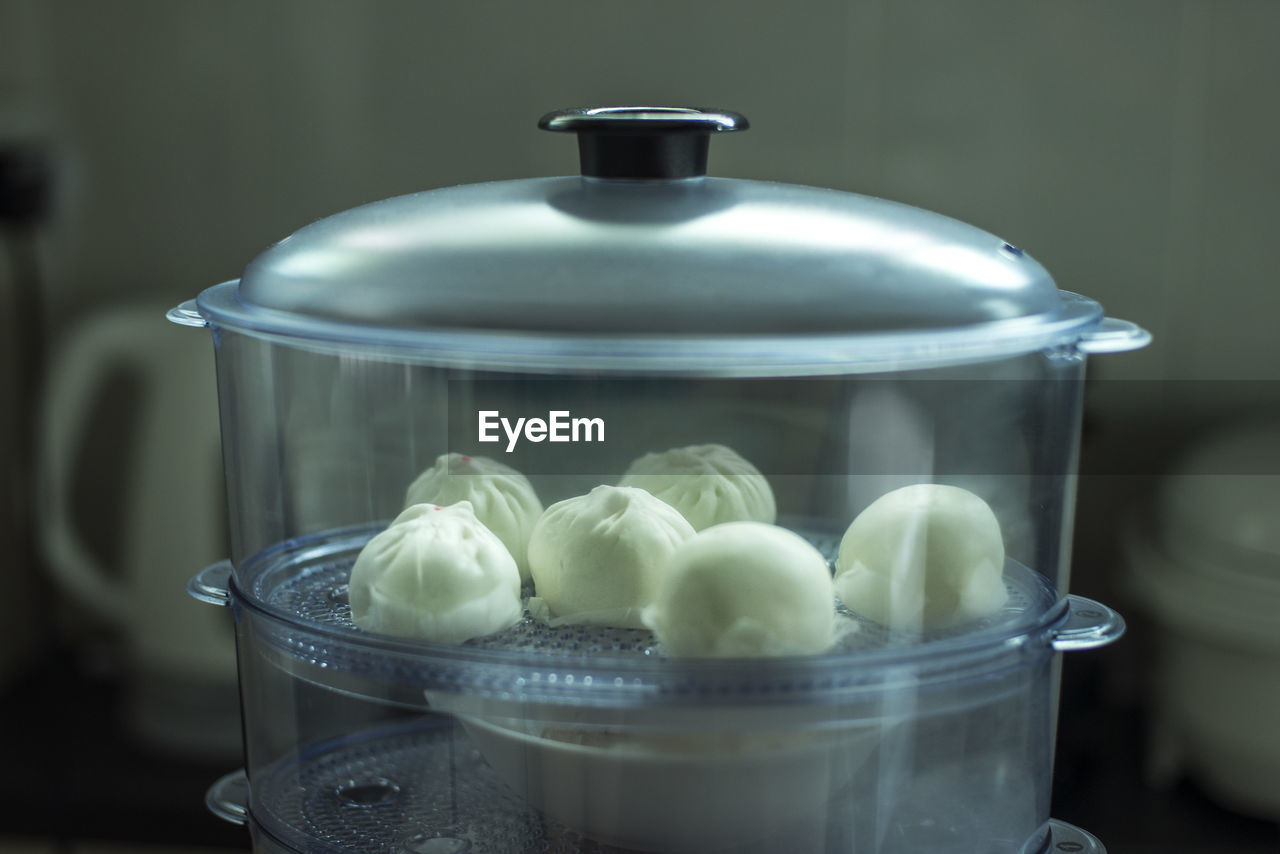 Close-up of buns in steamer