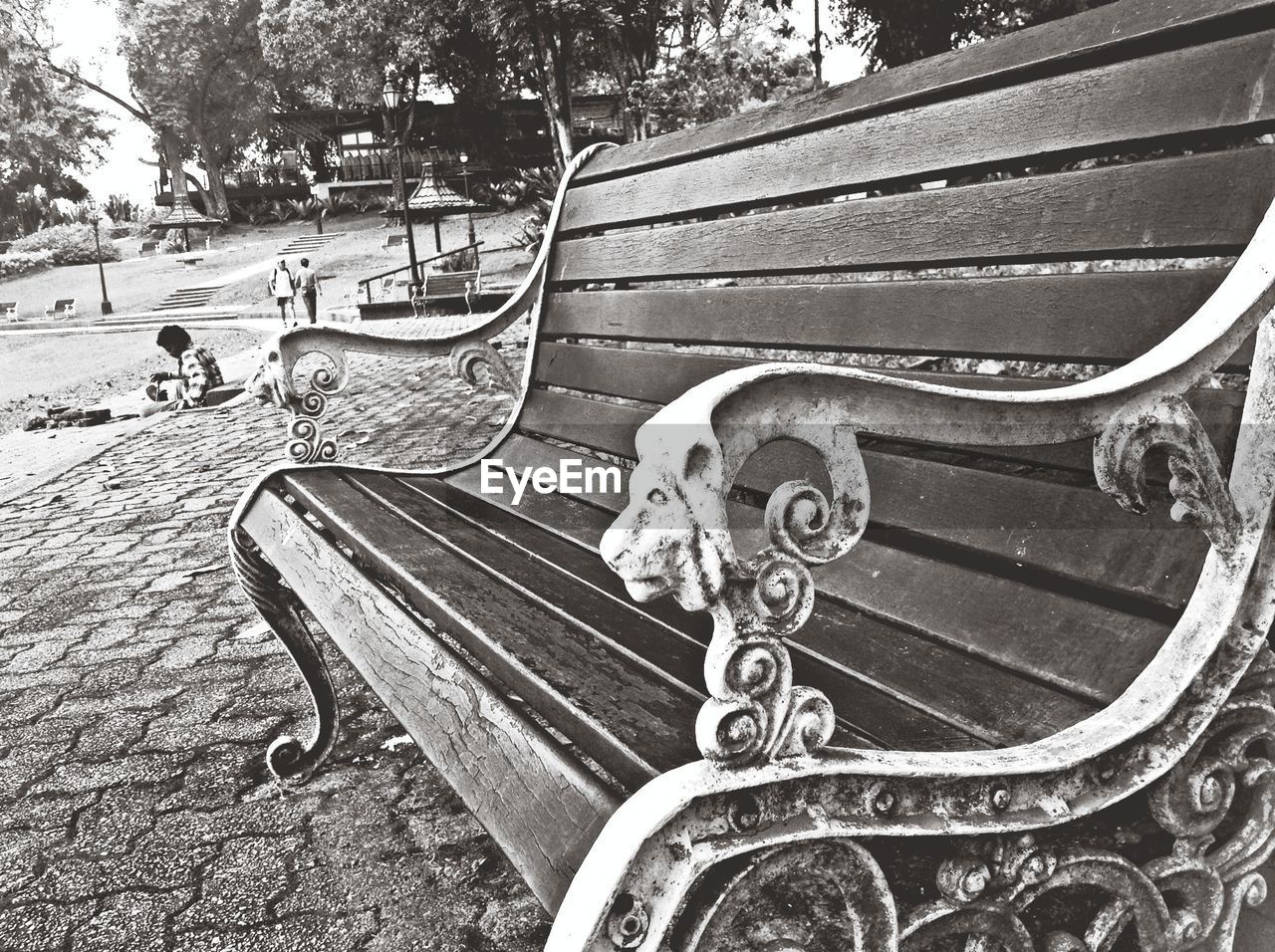Close up view of ornate bench on city street
