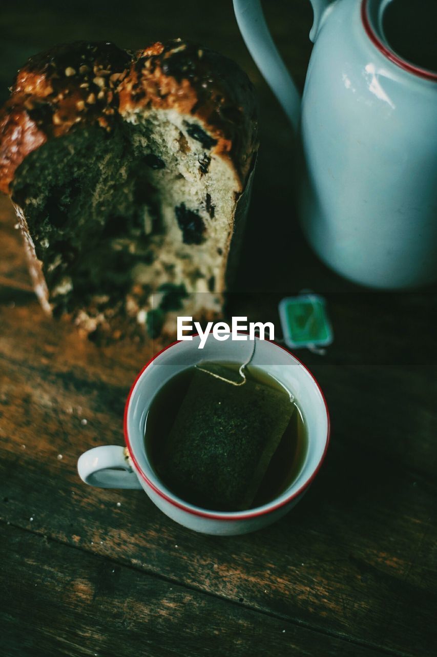 High angle view of tea and cake on table