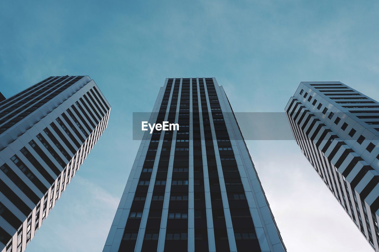 Low angle view of modern buildings against sky