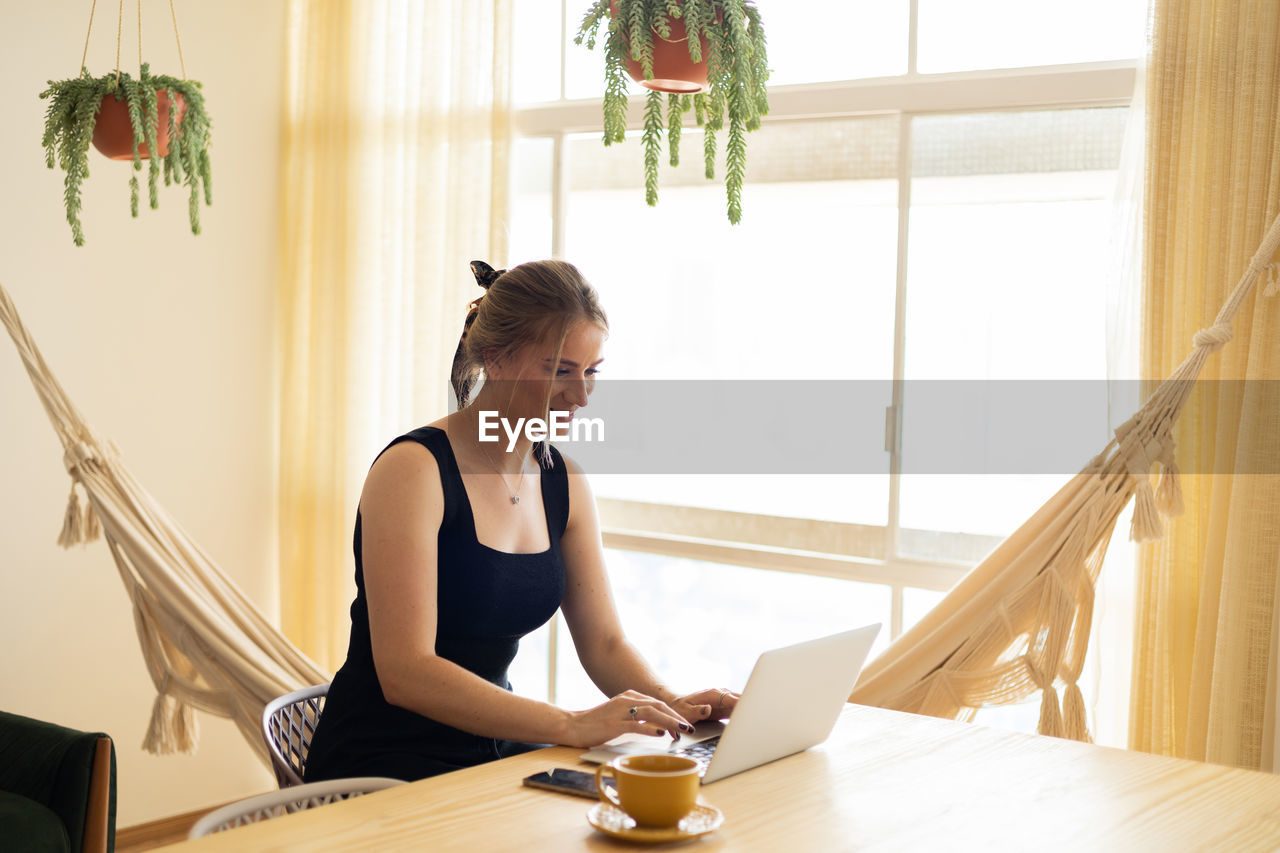 Woman working at home with laptop. home office.  notebook for working. 