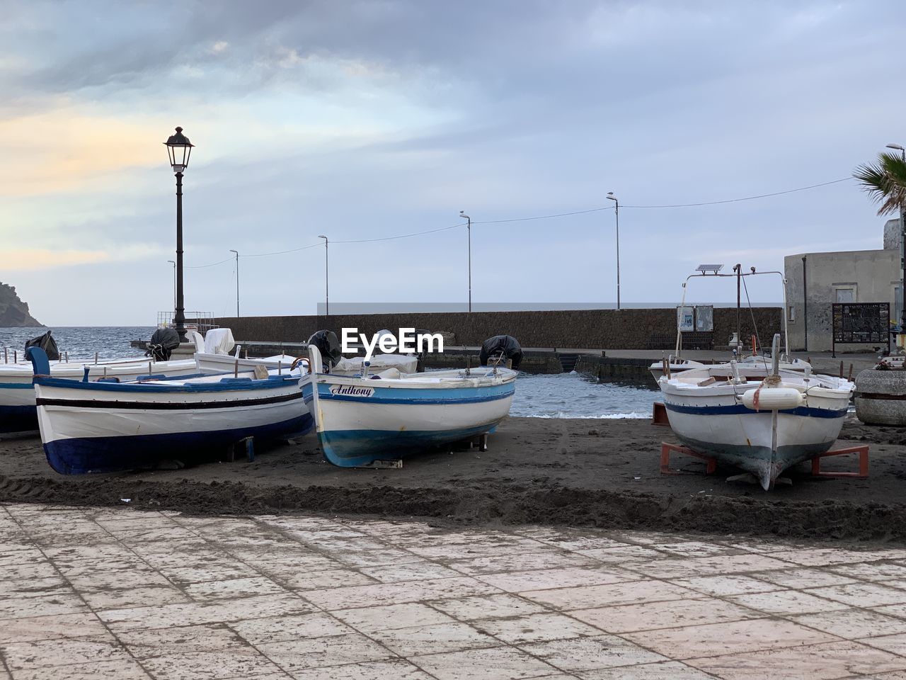 BOATS MOORED AT HARBOR