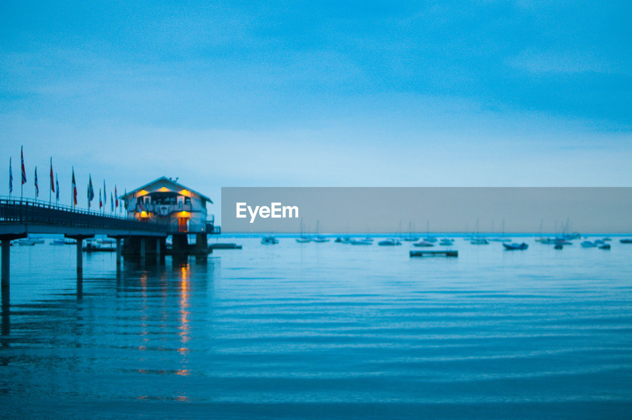 VIEW OF BOATS IN SEA