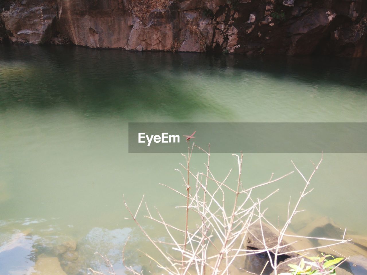 REFLECTION OF ROCKS IN LAKE