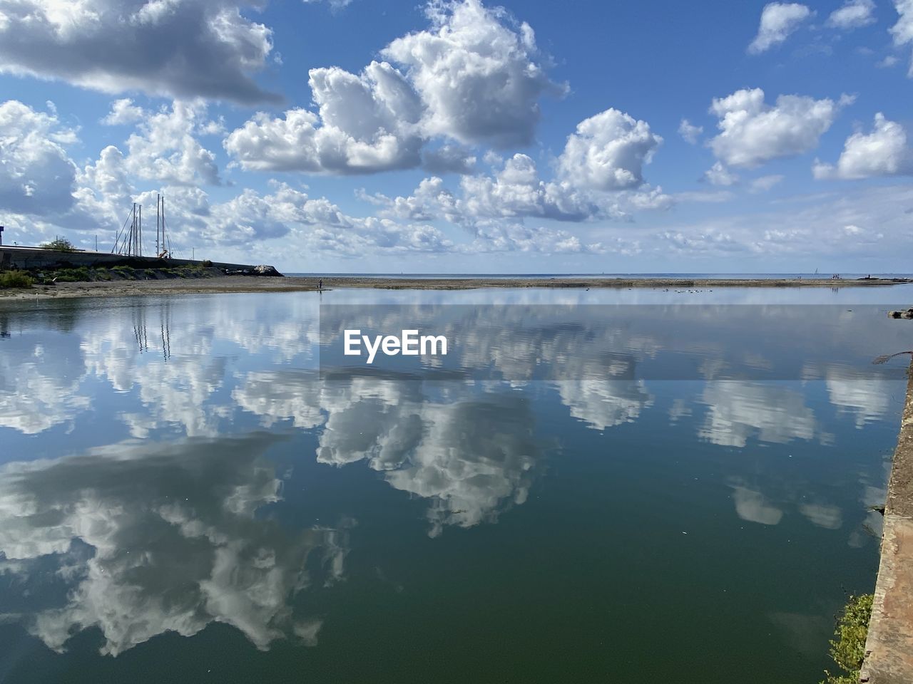 PANORAMIC VIEW OF LAKE AGAINST BLUE SKY