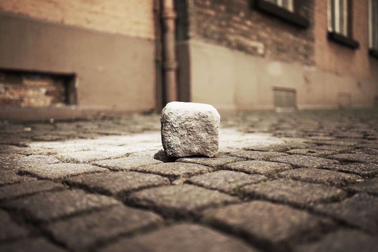 Block shape stone on walkway at night