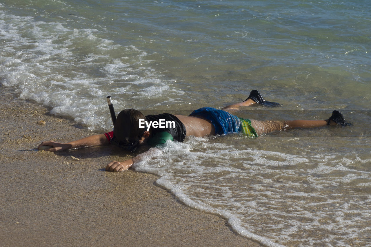 GROUP OF PEOPLE ON BEACH