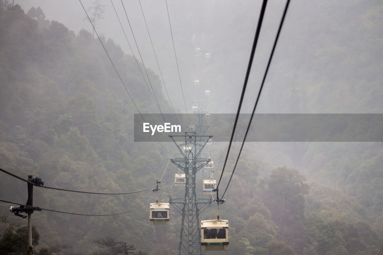 Cable cars in foggy weather