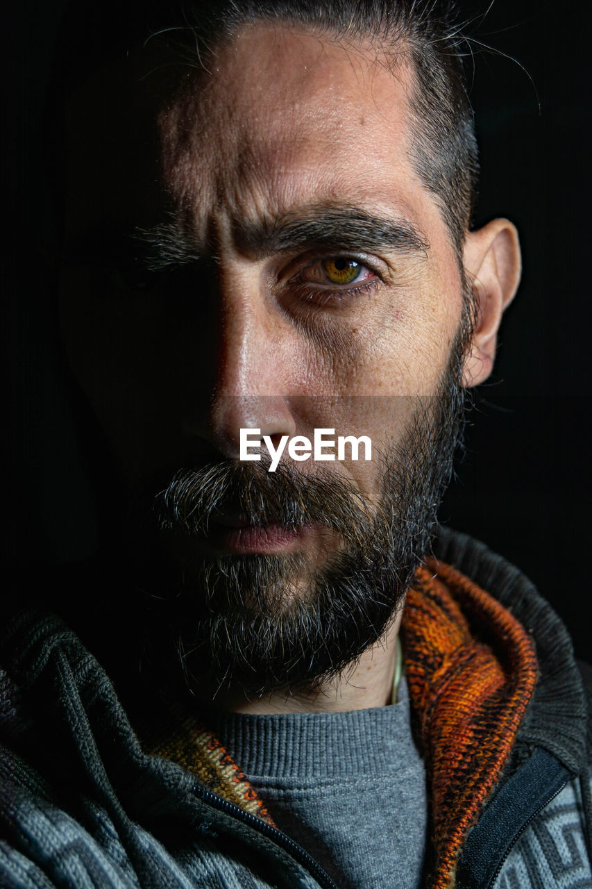 Close-up portrait of man wearing sunglasses