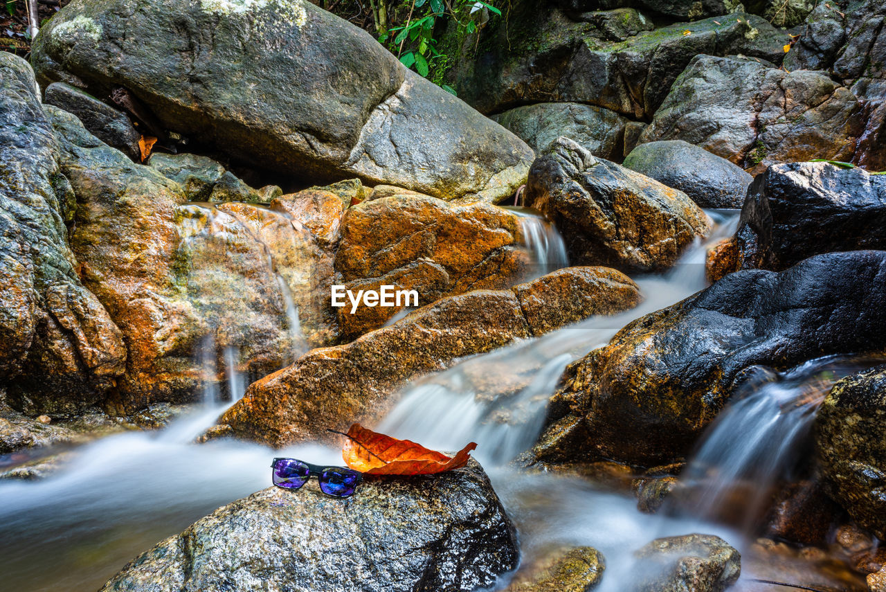 RIVER FLOWING AMIDST ROCKS