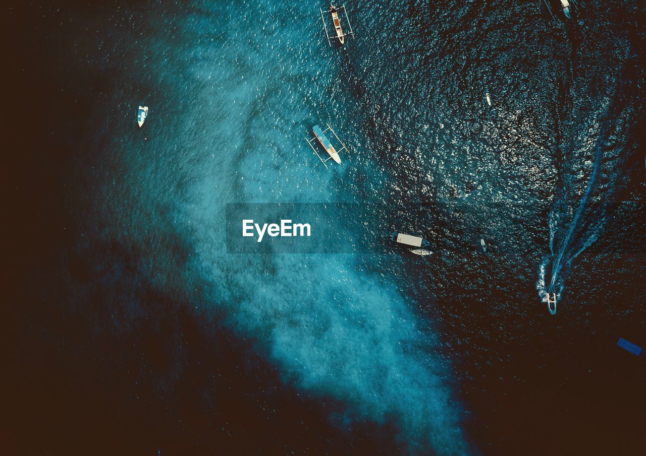 Aerial view of boats in sea at night
