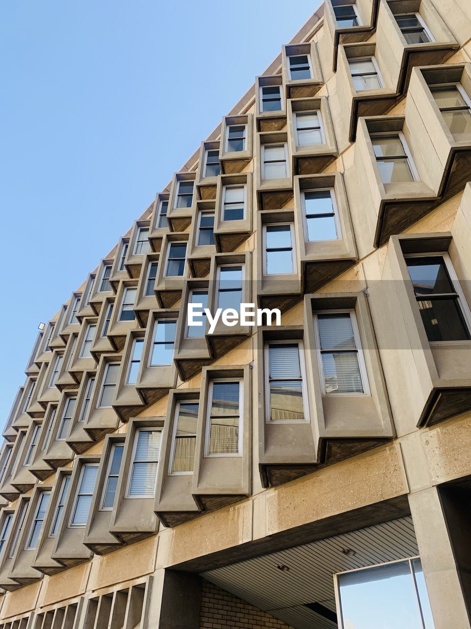 Low angle view of building against clear sky. cool architecture at wits university, south africa