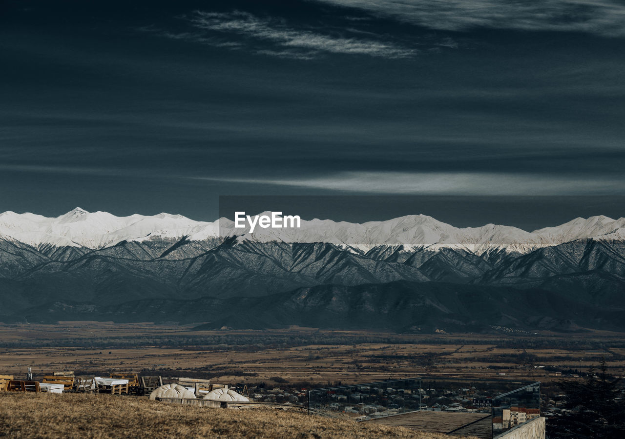 Scenic view of snowcapped mountains against sky