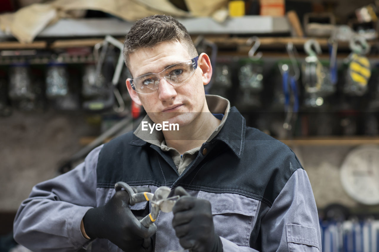 Plumber male working in a workshop