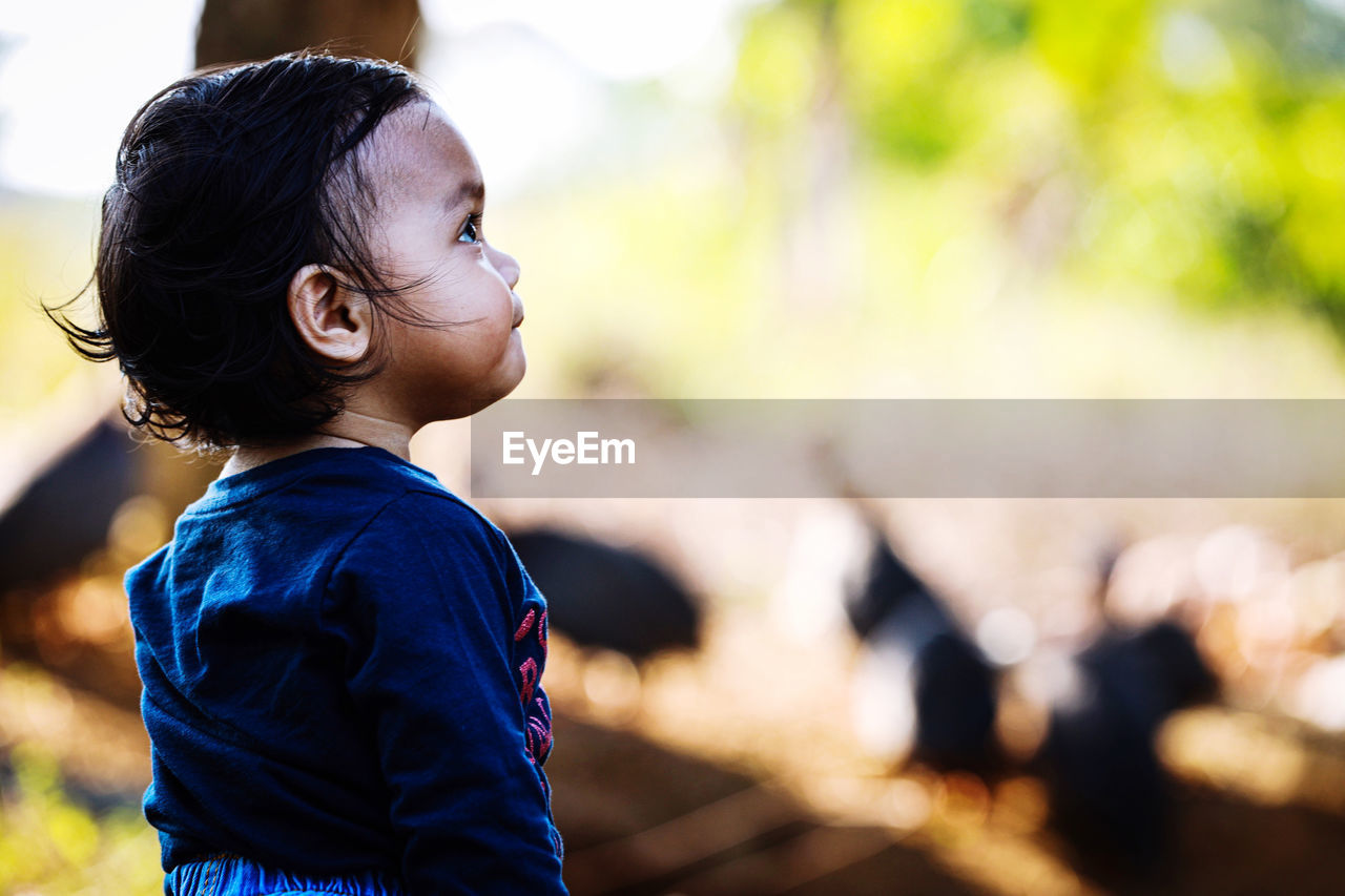 Side view of girl looking away