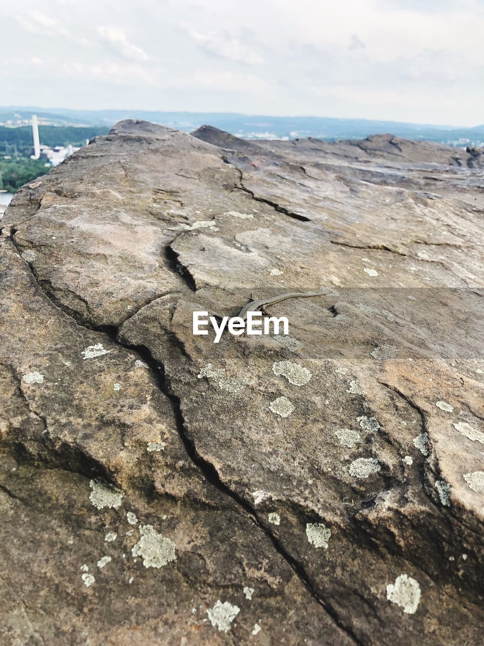 Scenic view of rocks on beach against sky