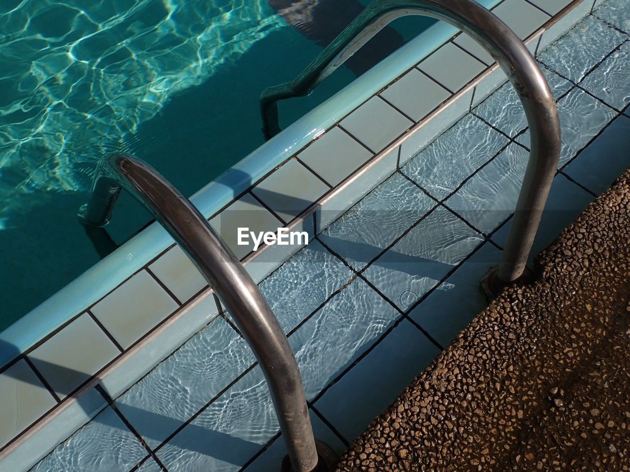 High angle view of ladder in swimming pool