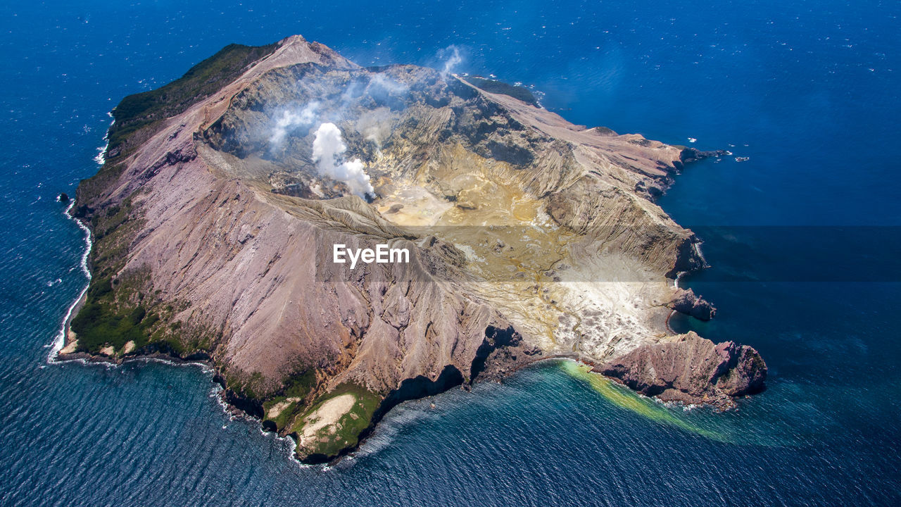 PANORAMIC VIEW OF ROCK FORMATIONS IN SEA